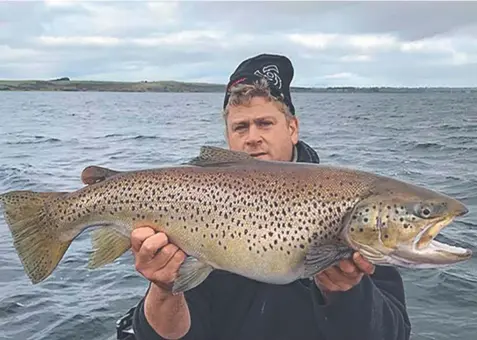  ??  ?? Declan Betts with the 6.22kg brown trout he caught from Lake Purrumbete on Friday. Picture: Victorian Fisheries Authority