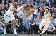  ?? [AP PHOTO] ?? Fouled with 8.4 seconds left Tuesday, Carmelo Anthony, center, missed two free throws that likely would have iced an Oklahoma City win at Boston.