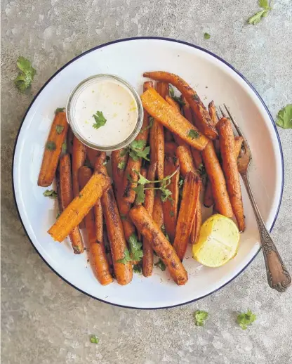  ?? LYNDA BALSLEV/TASTEFOOD ?? The sweetness of the roasted carrots in this recipe marries well with the spicy heat of harissa.