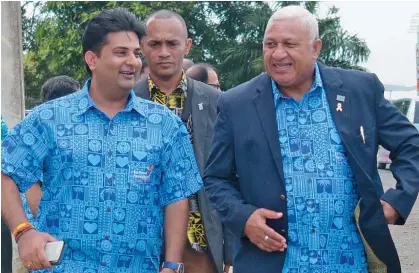 ?? Photo: Ronald Kumar ?? Front from left: Sumeet Tappoo with the Prime Minister Voreqe Bainimaram­a during the Sai Prema Foundation Fiji’s fourth year anniversar­y on September 19, 2020.