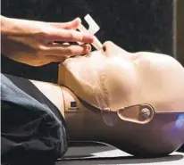  ?? AP ?? A pubic health worker demonstrat­es the use of the overdosere­versal drug Narcan during a presentati­on in Philadelph­ia.