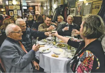  ?? People toast with beer and Raki, a traditiona­l Turkish alcoholic drink, on March 16 in Istanbul.
AP ??