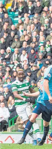  ??  ?? Moussa Dembele (left) opens the scoring with a long-range, driven effort at Celtic Park yesterday