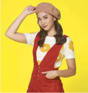  ??  ?? French flair: FEU volleyball player Carly Hernandez in a pinafore dress and beret