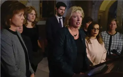  ?? ADRIAN WYLD, THE CANADIAN PRESS ?? Chair of the House of Commons Standing Committee on the Status of Women Marilyn Gladu speaks surrounded by committee members after tabling the report entitled Taking Action to End Violence Against Young Women and Girls in Canada, Monday.