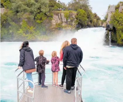  ?? Photo / LoveTaupo ?? Tourists enjoying the Huka Falls family river cruise.