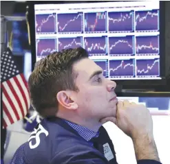  ?? — AP ?? NEW YORK: Specialist Robert Tuccillo works on the floor of the New York Stock Exchange.