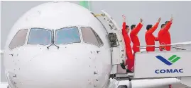  ?? ALY SONG / AFP / GETTY IMAGES ?? A C919 passenger jet sits after its maiden flight in Shanghai on May 5, marking a key milestone in China’s attempt to compete with the world’s aircraft makers.