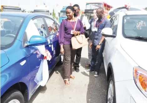  ?? Photo: Ben Atonko ?? Guests take a look at the Chinese brand of cars at the Abuja Motor Fair Saturday