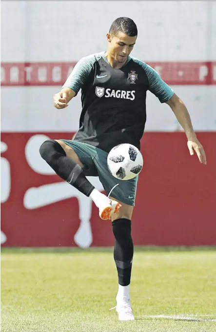  ?? THE ASSOCIATED PRESS ?? Like Argentina’s Lionel Messi, Portugal’s Cristiano Ronaldo, seen at practice Sunday, has a mediocre squad to work with at the World Cup, but he’s been hell bent to push them through the group stage.