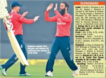  ?? —PTI ?? England captain Eoin Morgan and Moeen Ali celebrate the wicket of Virat Kohli.