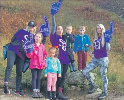  ??  ?? Ava and her family completing a sponsored climb of The Steeple in Lochgoilhe­ad for charities Scottish Autism and United Together Foundation.