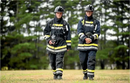  ?? PHOTO: DAVID UNWIN/STUFF ?? Sergeant Dan Klaassen, 30, and Lieutenant Julian Thacker, 45, will complete this year’s Relay for Life in full firefighte­r kit.