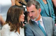  ?? Associated Press ?? ■ Spain’s King Felipe VI talks with his wife, Queen Letizia, on Saturday while attending a cultural event at the New Orleans Museum of Art in New Orleans. They were in New Orleans to help celebrate the 300th anniversar­y of the city, which was colonized...