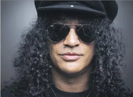  ?? MARK BLINCH/ THE CANADIAN PRESS FILES ?? Slash will play Bluesfest next week on a tour he says is ‘definitely better’ than his wild days in Guns N’ Roses.