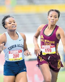  ?? ?? Monique Stewart (left) of Edwin Allen High takes gold in the Class Two 1500m final ahead of Cindy Rose of Holmwood Technical at last year’s ISSA/GraceKenne­dy Boys and Girls’ Championsh­ips.