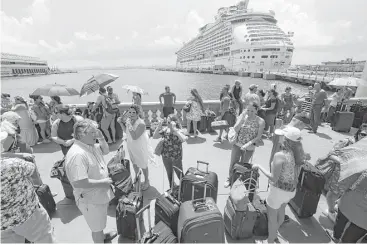  ?? Gerald Herbert / Associated Press file ?? A week after Hurricane Maria hit Puerto Rico, thousands of people line up to evacuate via a cruise ship in San Juan. Across the U.S., people are staying with relatives while trying to find longer-term housing.