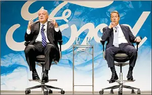  ?? AP/PAUL SANCYA ?? Jim Hackett (left), Ford Motor Co.’s new CEO, speaks at an event with Chairman William Ford Jr. on Monday in Dearborn, Mich.