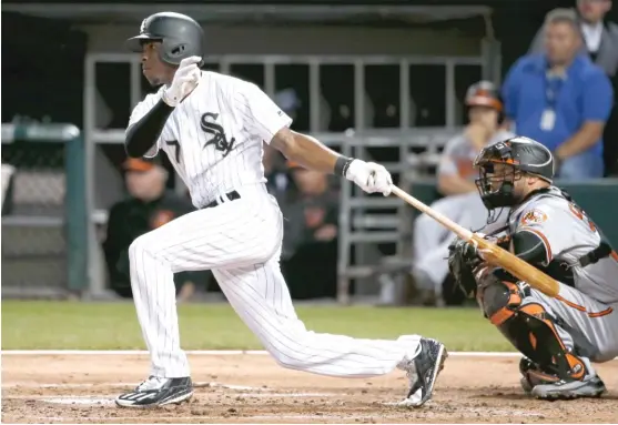  ?? | CHARLES REX ARBOGAST/ AP ?? Tim Anderson follows through on his two- run single off Orioles right- hander Dylan Bundy in the first inning Wednesday at Guaranteed Rate Field.