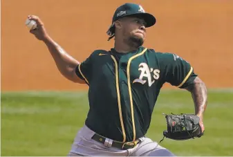  ?? Ashley Landis / Associated Press ?? Neither Frankie Montas nor the other three Oakland starters could last five innings against the Astros at Dodger Stadium. Montas flirted with 100 mph on his fastball in Thursday’s loss.