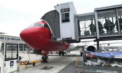  ??  ?? Norwegian Air is one of the carriers most exposed to the US ban and is temporaril­y laying off half its staff. Photograph: Lefteris Karagianno­poulos/Reuters