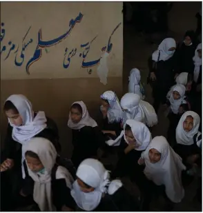  ?? (AP/Felipe Dana) ?? Girls walk upstairs Sunday as they enter a school before class in Kabul, Afghanista­n.