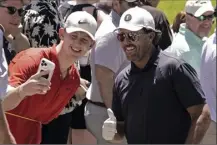  ?? AP photo ?? Phil Mickelson poses for a photo with a fan during a practice round ahead of the U.S. Open on Tuesday.