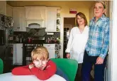  ?? Brett Coomer / Staff photograph­er ?? Isaac Heider, 12, and his parents Carol and Clinton moved to Montrose after their Meyerland home flooded numerous times, including during Hurricane Harvey.