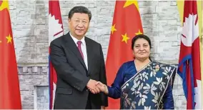  ?? Strong friendship: Xi shaking hands with Bhandari in Kathmandu. ?? — Xinhua