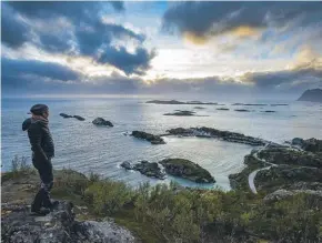  ??  ?? Sarah Marshall looking out to the Bergsoyan archipelag­o at midnight