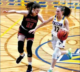  ?? PILOT PHOTO/RON HARAMIA ?? Triton’s Jocelynn Faulkner (right) brings the ball down court while Glenn’s Emma Norton defends. Triton hosts Plymouth tonight, while Glenn’s next game is Friday at home.