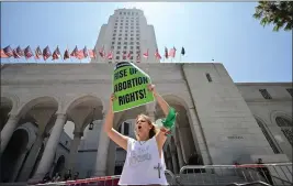 ?? FREDERIC J. BROWN — AFP VIA GETTY IMAGES — TNS ?? Abortion rights activists protest on the steps of City Hall in Los Angeles on July 6to call on the federal government to restore abortion rights nationwide now.