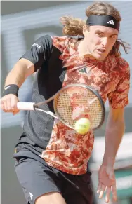  ?? — AFP ?? Greece’s Stefanos Tsitsipas plays a backhand return to Czech Republic’s Jiri Vesely during their match on day one of the French Open tournament at Roland Garros.