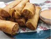  ?? Emma Balter / Staff ?? Crawfish Cafe’s crawfish eggrolls