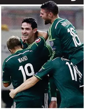  ??  ?? National hero: Lafferty (centre) was pivotal in guiding Northern Ireland to Euro 2016 and has now targeted the World Cup finals