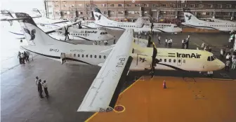  ?? AP PHOTO ?? WINGING IT: Iran Air’s new commercial planes are parked at Mehrabad airport in Tehran, Iran, yesterday.