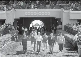  ?? Benoit Photo ?? JUSTIFY, whose six wins didn’t include any at Del Mar, is brought onto the track Saturday. “If anyone deserves to be retired, it’s him,” says jockey Mike Smith.