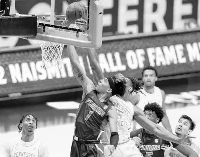  ?? MARK HUMPHREY/AP ?? Florida’s Tre Mann (1) shoots over Tennessee’s Yves Pons (35) on Friday.