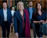  ??  ?? French presidenti­al candidate and National Front president Marine Le Pen arrives to attend a rally along with her chief of staff Catherine Griset (right) and her bodyguard Thierry Legier (left) in Lyon, France.