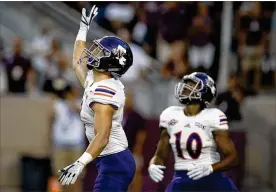  ?? SAM CRAFT / ASSOCIATED PRESS ?? Northweste­rn State’s Ryan Reed waves for a fair catch on the opening kickoff against Texas A&amp;M on Thursday. Under a new rule, if a fair catch on a kickoff is made inside the 25, it’s a touchback and marked at the 25.