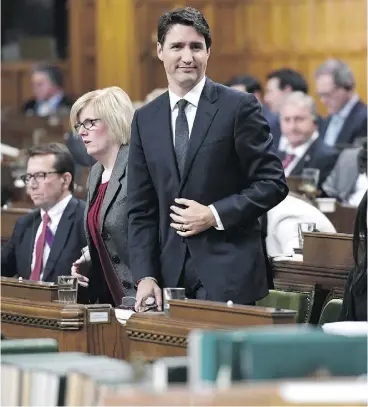  ?? JUSTIN TANG/THE CANADIAN PRESS ?? Prime Minister Justin Trudeau rises to vote during a marathon session in the House of Commons Friday, after the Conservati­ves vowed to call 259 votes of confidence in protest of being denied access to the national security adviser.