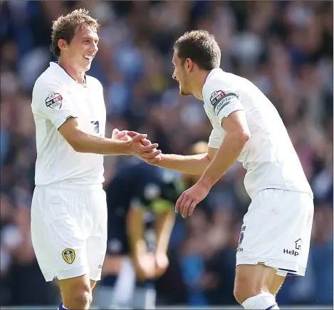  ?? PICTURES: Action Images ?? BOWING DOWN: Stephen Warnock is praised after scoring what would be Leeds’ only goal