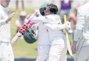  ?? AFP ?? Bangladesh’s Mominul Haque, left, and Mushfiqur Rahim celebrate their win against New Zealand.