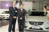  ?? Supplied photo ?? Tony Tarabay and BAIC Internatio­nal president Dong Haiyang with an A5 model displayed at the motor show. —