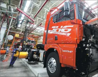  ?? LIANG XIAOPENG / FOR CHINA DAILY ?? An employee works on a production line of FAW Jiefang Automotive Co’s subsidiary in Qingdao, Shandong province.