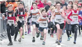  ??  ?? MARCH: Youngsters were part of the ‘runaway success’ at the Ron Hill 10k