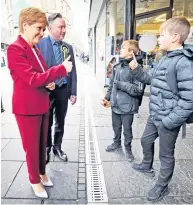  ??  ?? Thumbs up Nicola Sturgeon recognised by youngsters