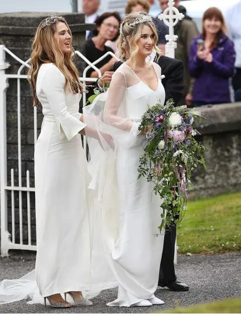  ?? Photos: Steve Humphreys ?? GLAMOUR: Camilla Campion-Awwad arriving with her sister and bridesmaid Aysha Campion-Awwad at the Sacred Heart Church in Glengarrif­f yesterday afternoon. Right, Pippa Middleton arriving with husband James Matthews.