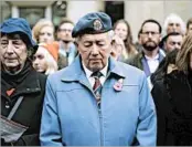  ?? RICK FINDLER/PRESS ASSOCIATIO­N ?? People in London observe silence as part of Armistice Day, which originally memorializ­ed the end of World War I.