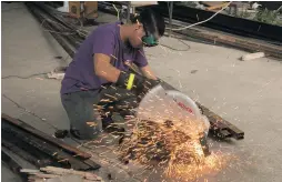  ?? CONTRIBUTE­D PHOTOS ?? Paulo (top, far right) bonding with company partners (from far left) Bryan Badajos, Kim David and Mar Mungcal; and employee Mike Acebutch (above) performs a welding job for a renovation project.